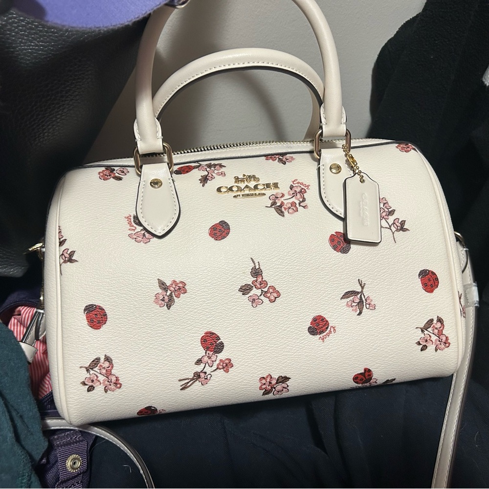 Brand new Coach satchel with ladybug floral print, no tags.